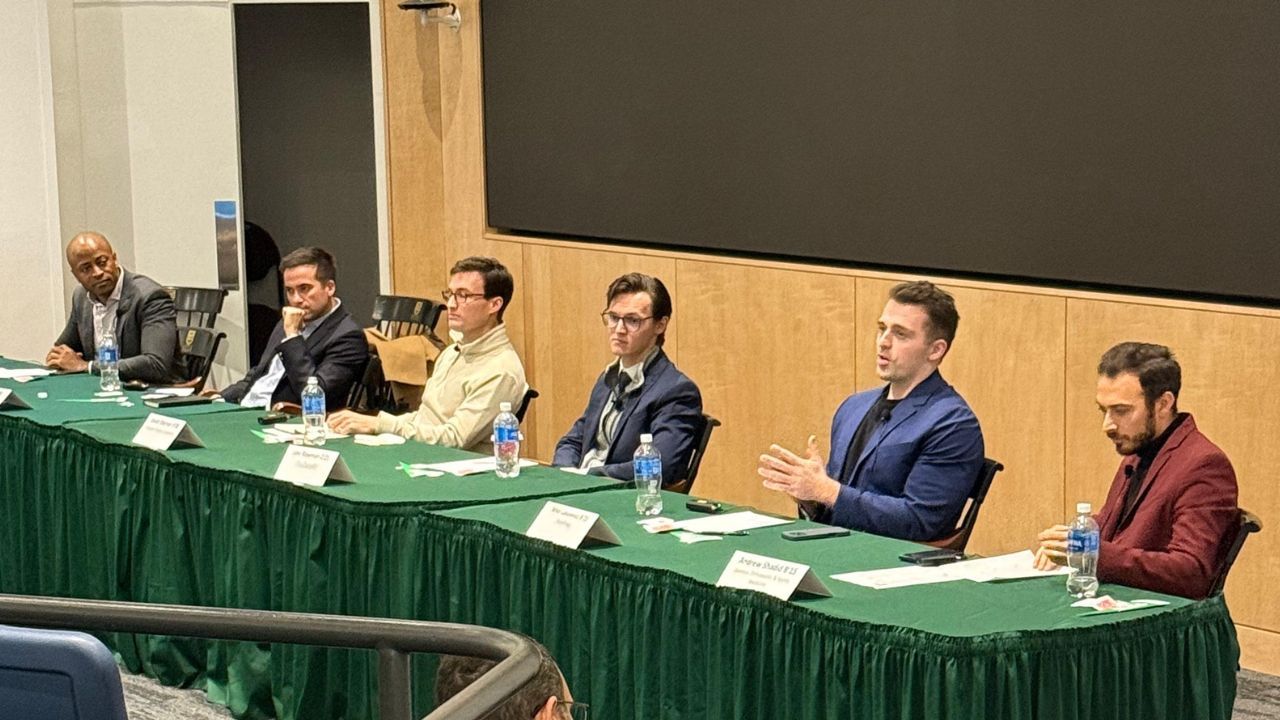 Mike speaking on a panel at Dartmouth